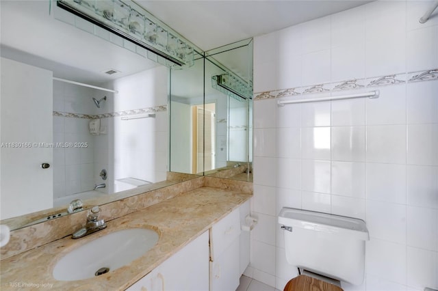 3725 S Ocean Dr Unit 1411, Hollywood, FL 33019 - full bath with vanity, tile walls, and bathtub / shower combination