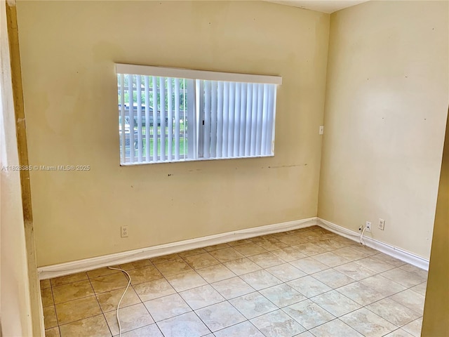 5221 Orange Dr, Davie, FL 33314 - tiled empty room with baseboards