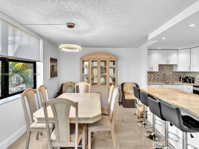 20401 NE 30th Ave Unit 310-8, Aventura, FL 33180 - dining room featuring recessed lighting, light tile patterned flooring, and a textured ceiling