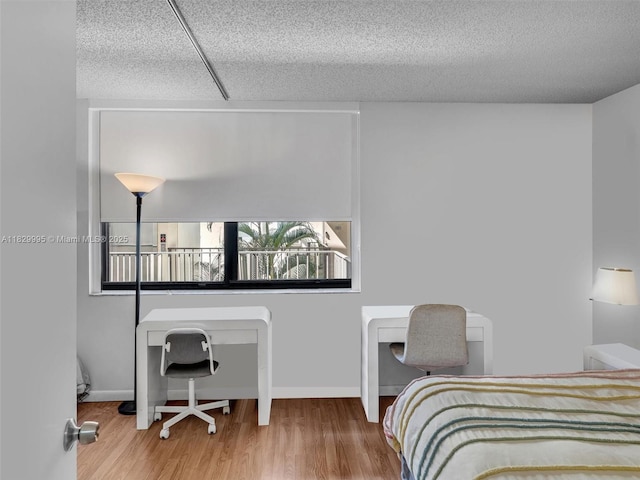 20401 NE 30th Ave Unit 310-8, Aventura, FL 33180 - bedroom with wood finished floors and baseboards