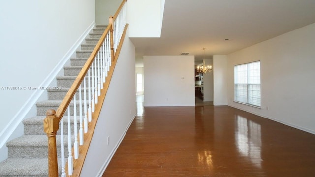 4407 Karlbrook Ln, ,, NC 27616 - stairs with a chandelier, plenty of natural light, and wood finished floors