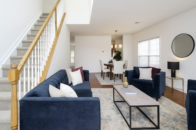 4407 Karlbrook Ln, ,, NC 27616 - living area with stairs, wood finished floors, and a chandelier