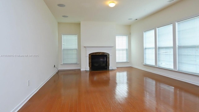 4407 Karlbrook Ln, ,, NC 27616 - unfurnished living room with wood finished floors and a premium fireplace