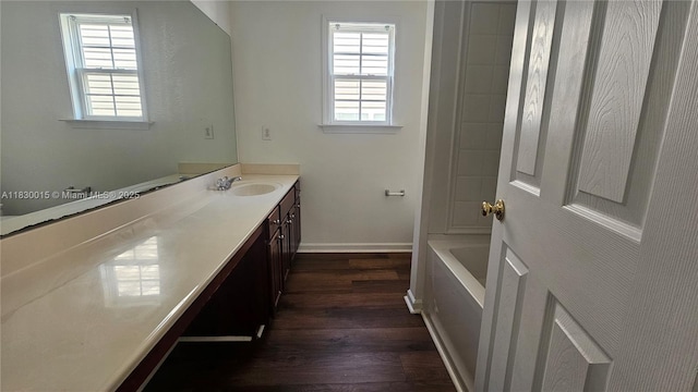 4407 Karlbrook Ln, ,, NC 27616 - bathroom with vanity, wood finished floors, plenty of natural light, and shower / bathtub combination