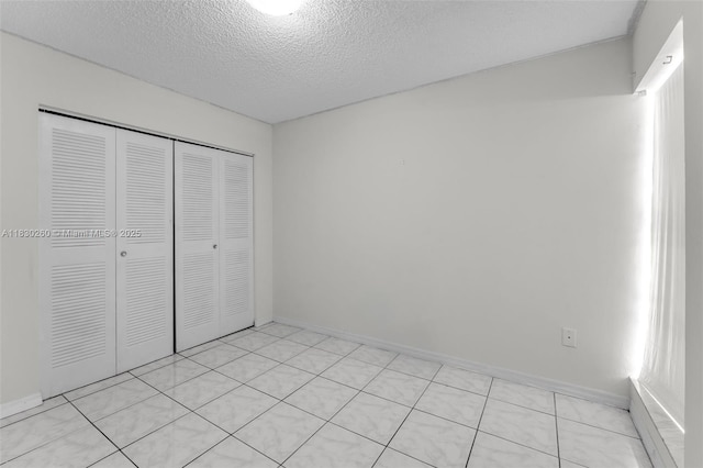 6908 SW 104th Ct, Miami, FL 33173 - unfurnished bedroom with a closet and a textured ceiling
