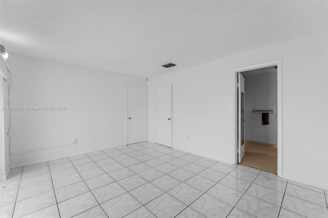 6908 SW 104th Ct, Miami, FL 33173 - unfurnished room featuring a textured ceiling