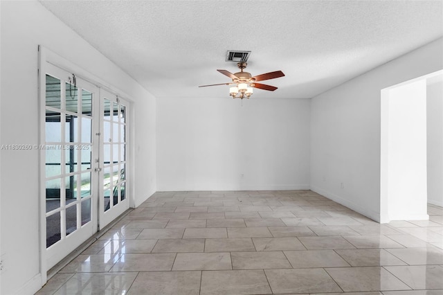 6908 SW 104th Ct, Miami, FL 33173 - empty room with french doors, a textured ceiling, and ceiling fan