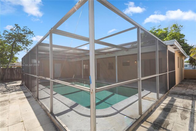 7816 Juniper St, Miramar, FL 33023 - view of swimming pool featuring a patio and glass enclosure