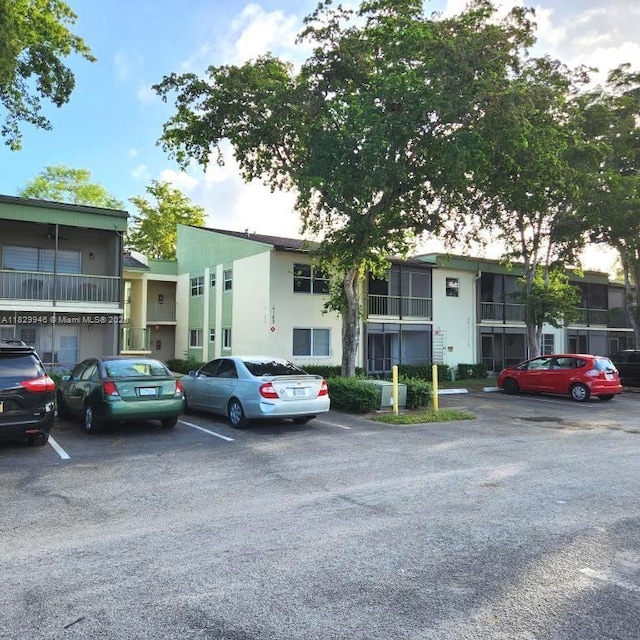 4163 NW 90th Ave Unit 206, Coral Springs, FL 33065 - view of property featuring uncovered parking