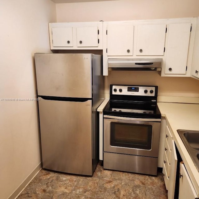 4163 NW 90th Ave Unit 206, Coral Springs, FL 33065 - kitchen with stainless steel appliances, under cabinet range hood, white cabinetry, and light countertops