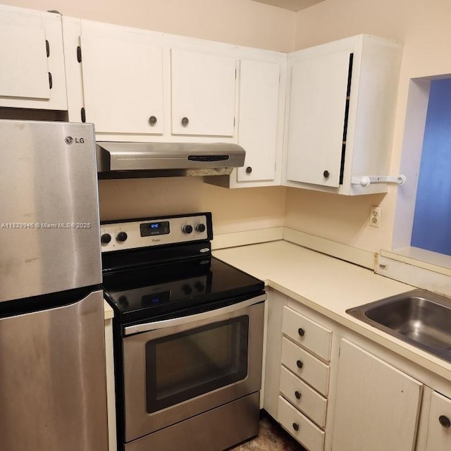 4163 NW 90th Ave Unit 206, Coral Springs, FL 33065 - kitchen featuring appliances with stainless steel finishes, under cabinet range hood, light countertops, and white cabinets
