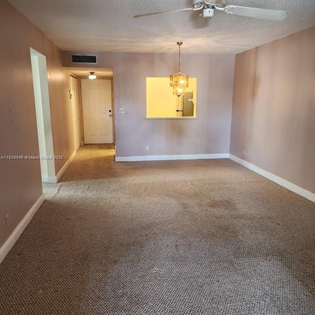 4163 NW 90th Ave Unit 206, Coral Springs, FL 33065 - carpeted empty room with a ceiling fan, a chandelier, and a textured ceiling