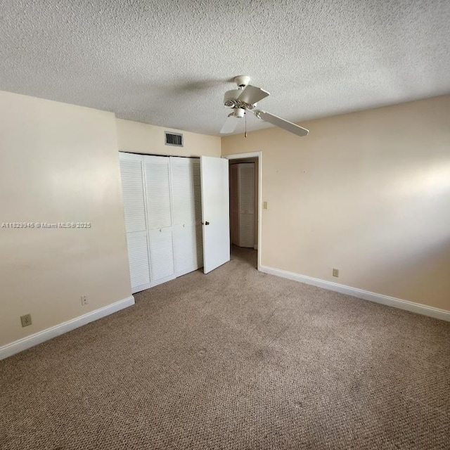 4163 NW 90th Ave Unit 206, Coral Springs, FL 33065 - unfurnished bedroom with carpet, ceiling fan, and a textured ceiling