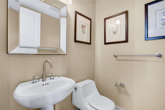 1425 Brickell Ave Unit 44A-B, Miami, FL 33131 - half bath with a sink and toilet