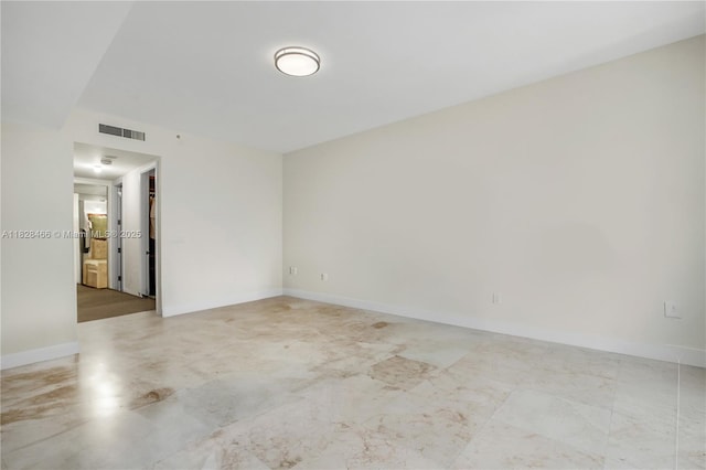 1425 Brickell Ave Unit 44A-B, Miami, FL 33131 - spare room featuring baseboards