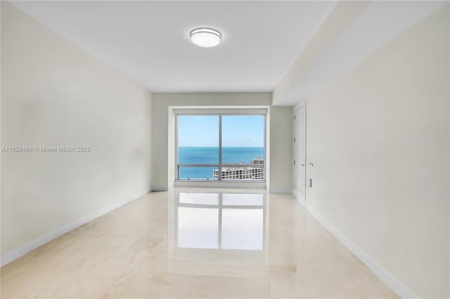 1425 Brickell Ave Unit 44A-B, Miami, FL 33131 - empty room featuring baseboards and a water view