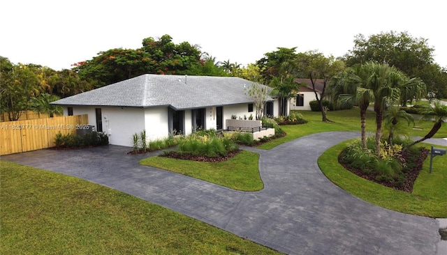 17902 SW 87th Pl, Palmetto Bay, FL 33157 - ranch-style home with stucco siding, roof with shingles, and curved driveway