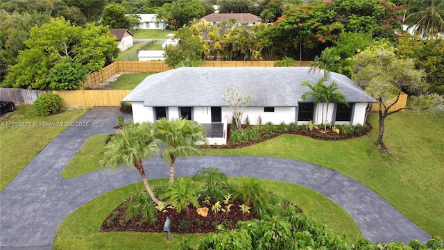 17902 SW 87th Pl, Palmetto Bay, FL 33157 - view of front facade featuring curved driveway, stucco siding, and a shingled roof