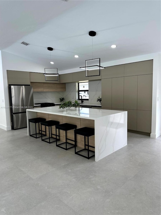17902 SW 87th Pl, Palmetto Bay, FL 33157 - kitchen with modern cabinets, freestanding refrigerator, gray cabinetry, a spacious island, and recessed lighting