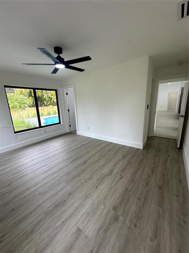 17902 SW 87th Pl, Palmetto Bay, FL 33157 - spare room featuring wood finished floors and a ceiling fan