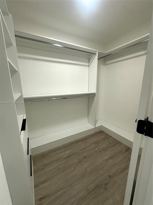 17902 SW 87th Pl, Palmetto Bay, FL 33157 - spacious closet featuring wood finished floors