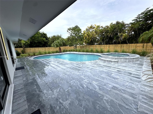 17902 SW 87th Pl, Palmetto Bay, FL 33157 - view of swimming pool with a fenced backyard, a patio area, and a pool with connected hot tub