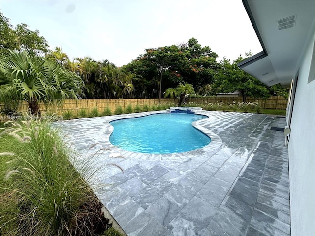 17902 SW 87th Pl, Palmetto Bay, FL 33157 - view of pool featuring a fenced backyard, a patio area, and a pool with connected hot tub