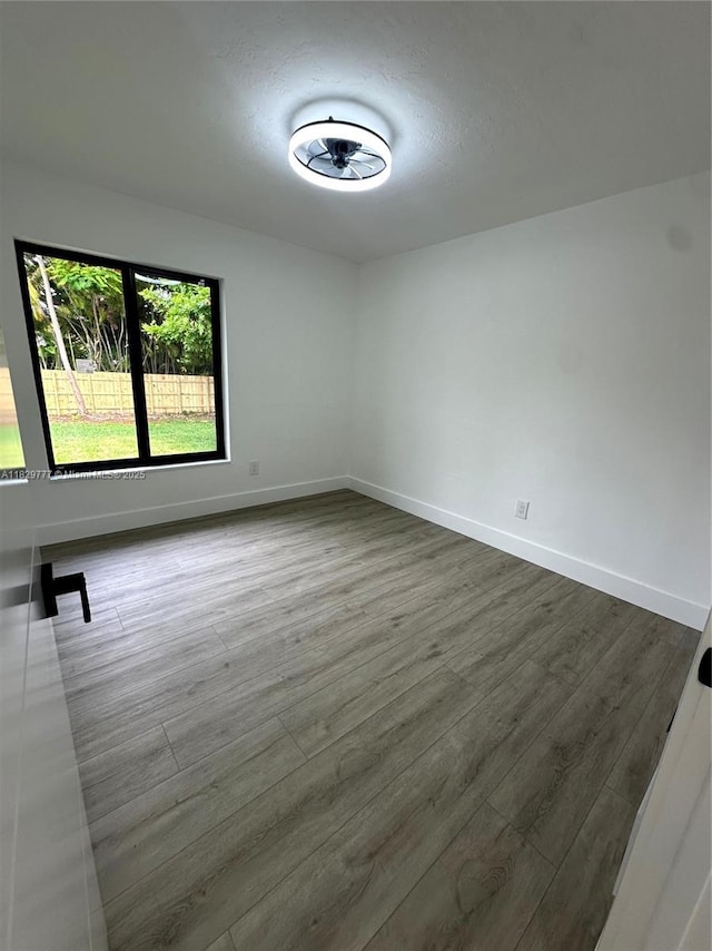 17902 SW 87th Pl, Palmetto Bay, FL 33157 - empty room featuring dark wood finished floors and baseboards