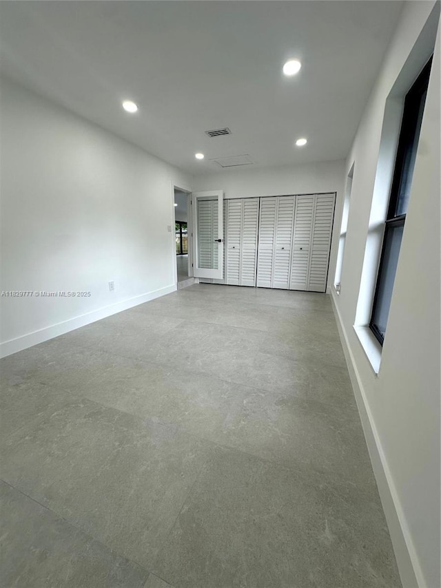 17902 SW 87th Pl, Palmetto Bay, FL 33157 - unfurnished bedroom with recessed lighting and concrete floors