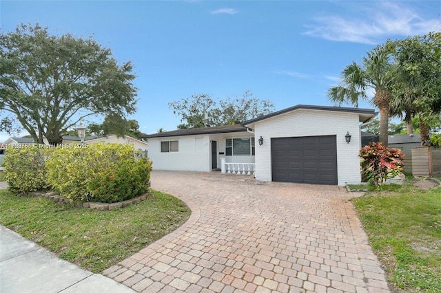 1840 N 56th Ave, Hollywood, FL 33021 - ranch-style house with an attached garage, decorative driveway, and brick siding