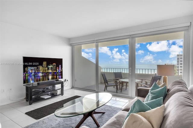 177 Ocean Lane Dr Unit 1203, Key Biscayne, FL 33149 - living room featuring tile patterned flooring, plenty of natural light, and a water view