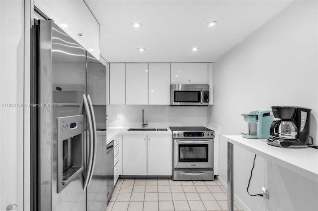 177 Ocean Lane Dr Unit 1203, Key Biscayne, FL 33149 - kitchen with stainless steel appliances, white cabinets, light countertops, modern cabinets, and light tile patterned flooring