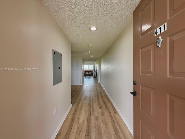1400 SW 137th Ave Unit 411F, Pembroke Pines, FL 33027 - hallway featuring electric panel, a textured ceiling, light wood-style floors, and recessed lighting