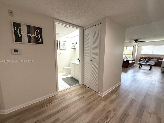 1400 SW 137th Ave Unit 411F, Pembroke Pines, FL 33027 - hallway with wood finished floors and a textured ceiling