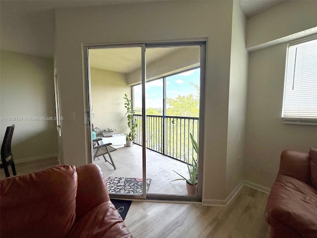 1400 SW 137th Ave Unit 411F, Pembroke Pines, FL 33027 - living room with wood finished floors and baseboards