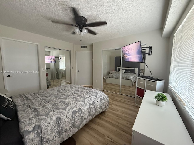 1400 SW 137th Ave Unit 411F, Pembroke Pines, FL 33027 - bedroom with wood finished floors, a ceiling fan, and a textured ceiling