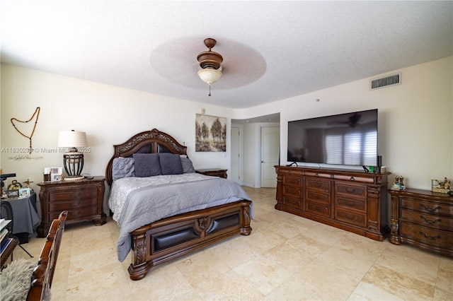 9 NE 20th Ave Unit 201, Deerfield Beach, FL 33441 - bedroom with a textured ceiling and ceiling fan