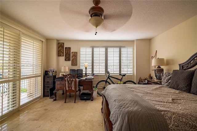 9 NE 20th Ave Unit 201, Deerfield Beach, FL 33441 - bedroom featuring a ceiling fan and a textured ceiling