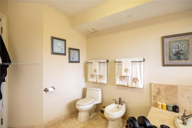 9 NE 20th Ave Unit 201, Deerfield Beach, FL 33441 - bathroom with a bidet and tile patterned floors