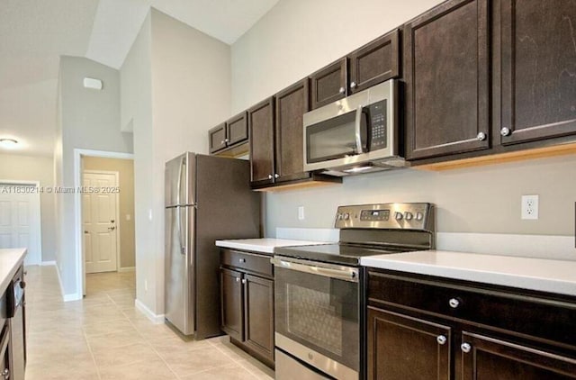 3574 SW Masilunas St, Port St Lucie, FL 34953 - kitchen featuring appliances with stainless steel finishes, light countertops, dark brown cabinets, and light tile patterned flooring