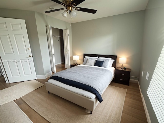 3574 SW Masilunas St, Port St Lucie, FL 34953 - bedroom with wood finished floors, a closet, and ceiling fan