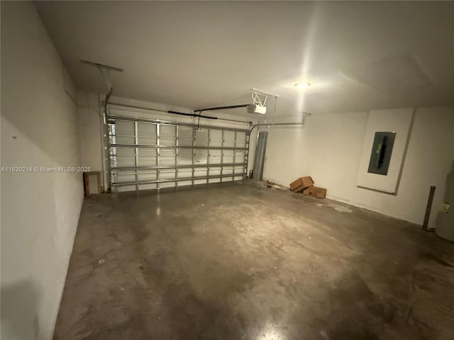 3574 SW Masilunas St, Port St Lucie, FL 34953 - garage featuring electric panel and a garage door opener