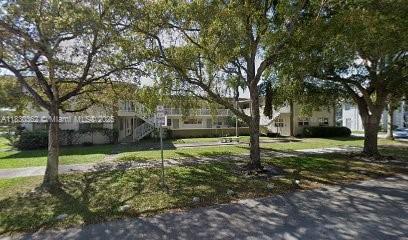 3500 Harrison St Unit 10, Hollywood, FL 33021 - view of front of home featuring a front yard