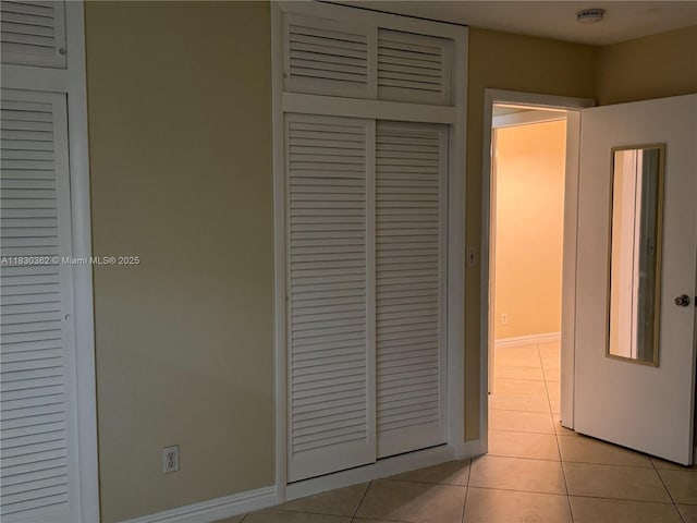3500 Harrison St Unit 10, Hollywood, FL 33021 - hallway featuring light tile patterned flooring and baseboards