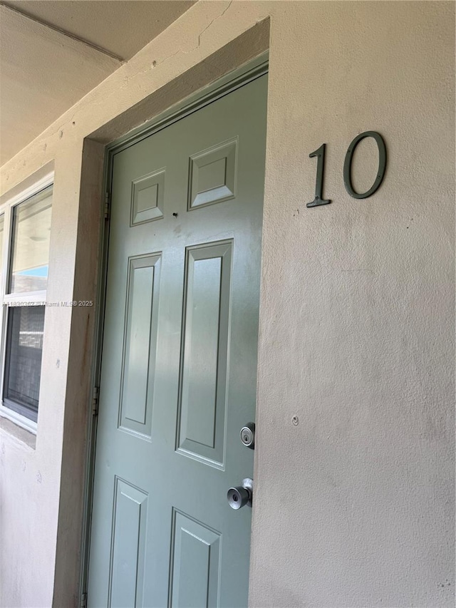 3500 Harrison St Unit 10, Hollywood, FL 33021 - doorway to property with stucco siding