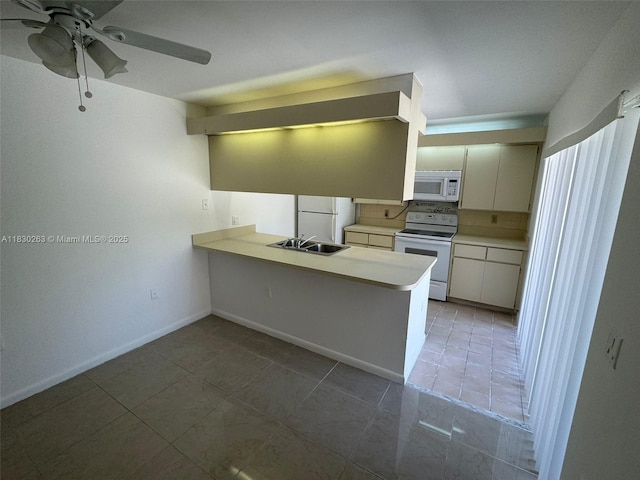 719 Mill Valley Pl, West Palm Beach, FL 33409 - kitchen with white appliances, light tile patterned floors, ceiling fan, and light countertops