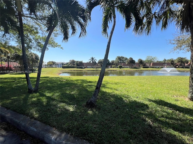 719 Mill Valley Pl, West Palm Beach, FL 33409 - view of green lawn featuring a water view
