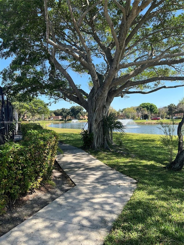 719 Mill Valley Pl, West Palm Beach, FL 33409 - view of home's community featuring a water view and a lawn