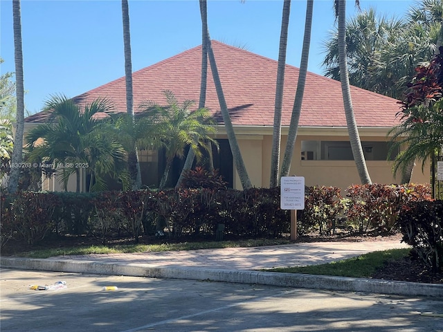 719 Mill Valley Pl, West Palm Beach, FL 33409 - view of side of home with stucco siding