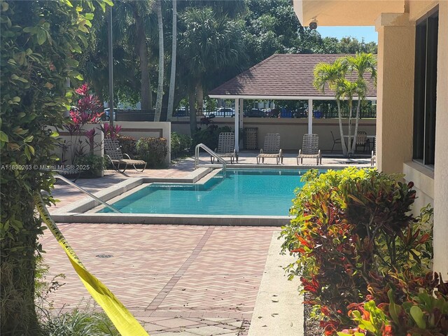 719 Mill Valley Pl, West Palm Beach, FL 33409 - community pool featuring a gazebo and a patio area
